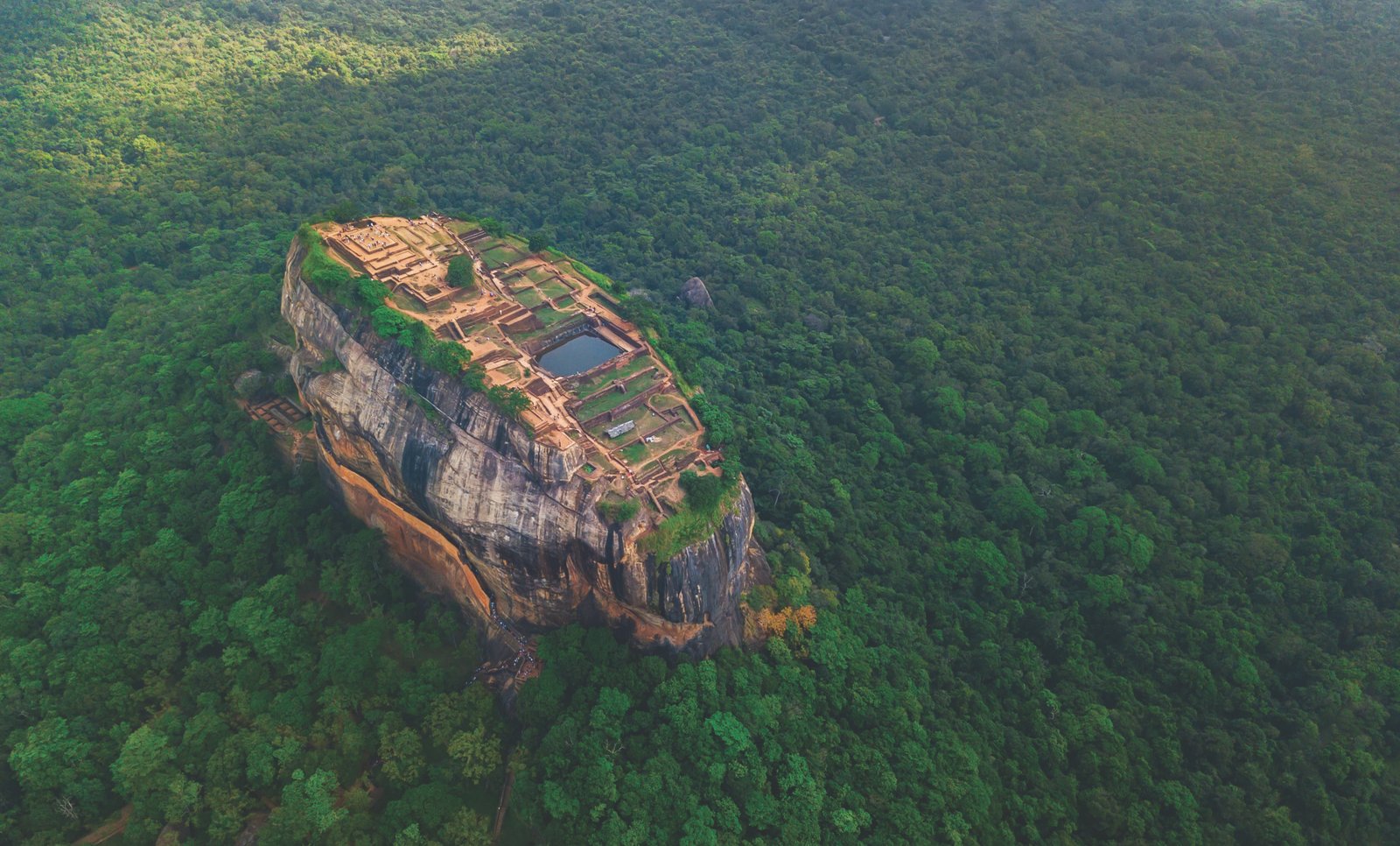 Aerial view of Sigiriya rock at misty morning, Sri Lanka. Drone footage.
